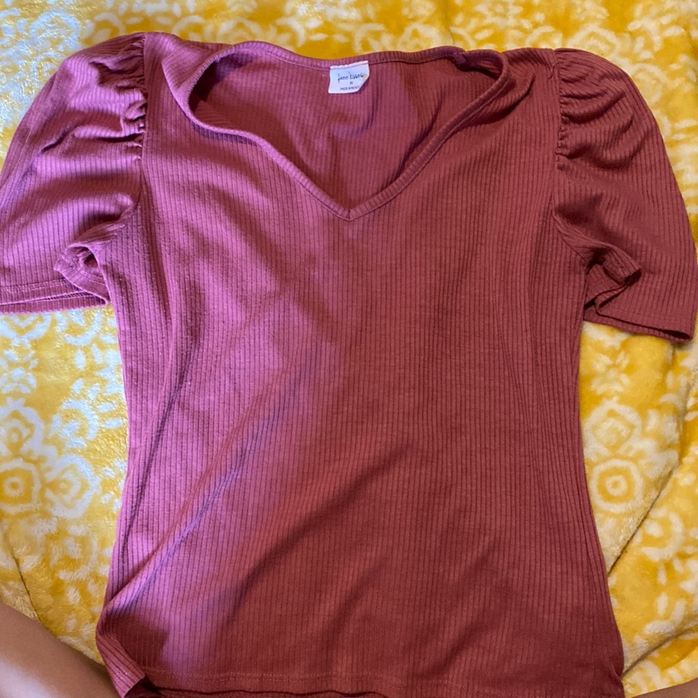 pink shirt with ruffled short sleeves